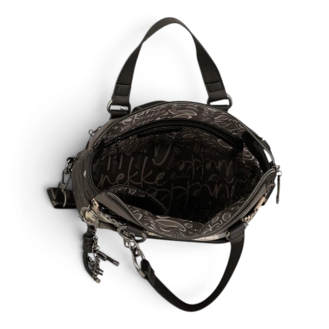 Open interior of an ada-shoes.ro Anekke convertible backpack featuring custom logo lining and organized compartments