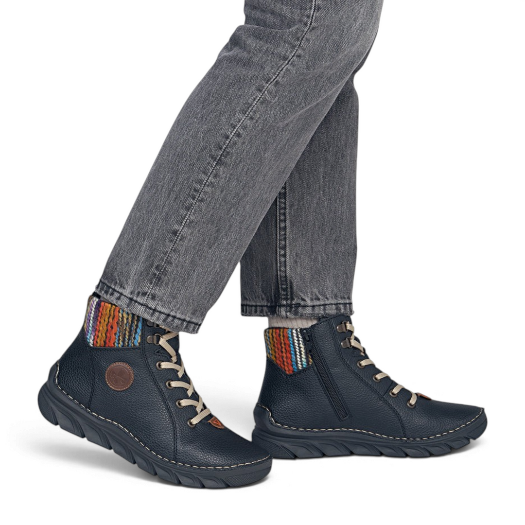 ada-shoes.ro Rieker black ankle boots with multicolor knitted collar, cream laces, and side zipper on a model