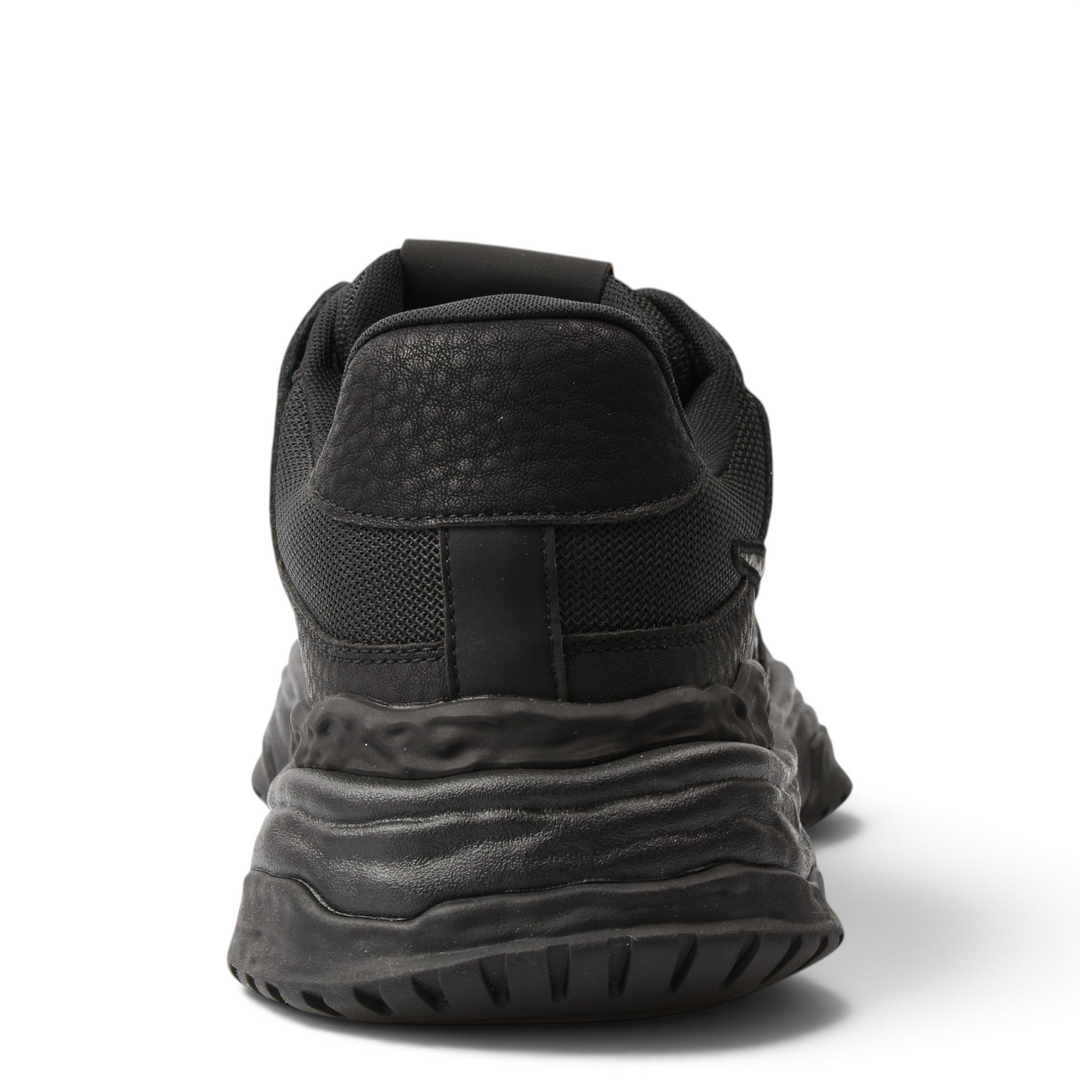 Back view of black ADA SHOES 8132-N nubuck leather sneakers with a thick, flexible sole and textured urban design.