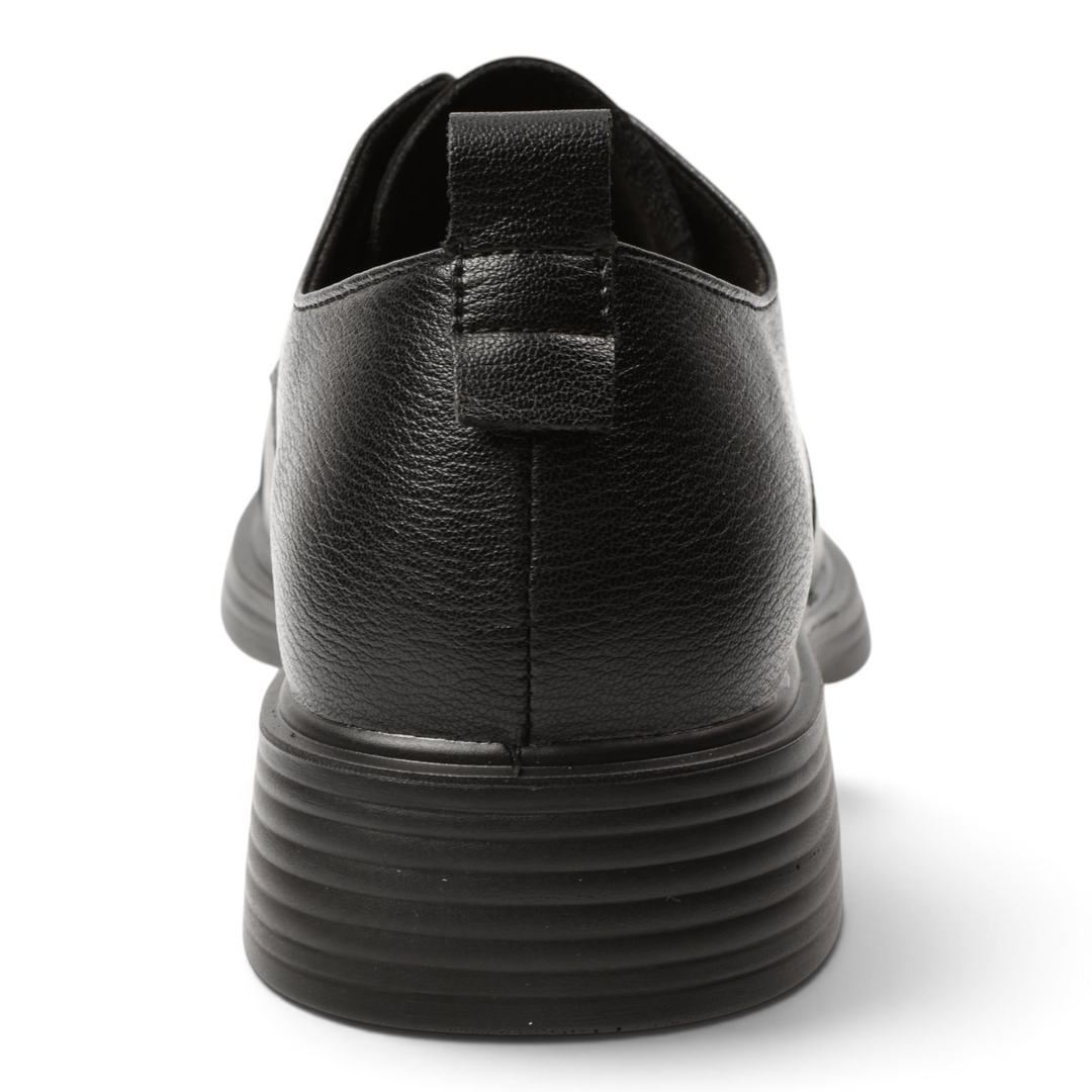 Back view of black leather casual shoes by ada-shoes.ro featuring a textured finish and a sturdy ribbed sole.
