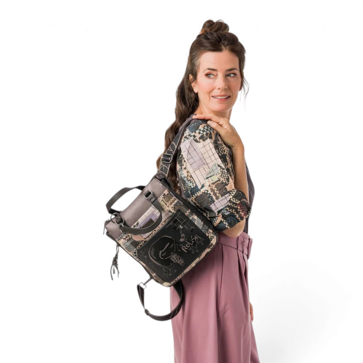 Woman wearing a convertible Anekke backpack with geometric mosaic print and metallic grey details from ada-shoes.ro
