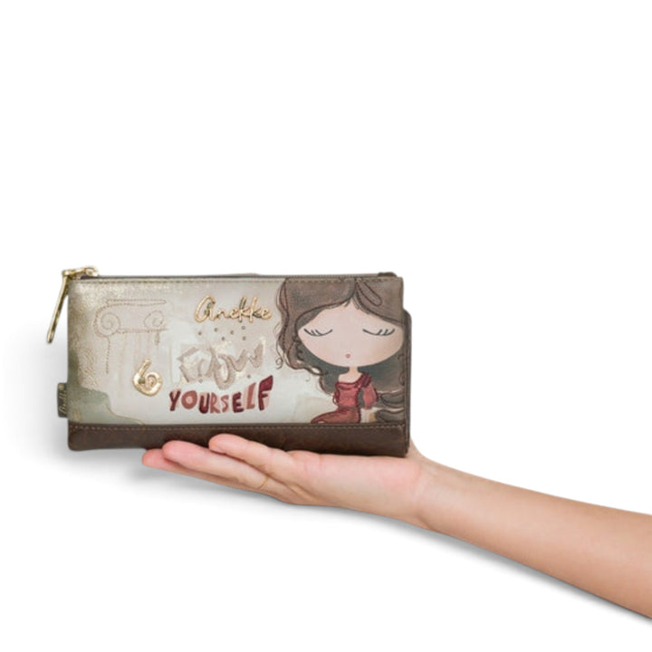 ada-shoes.ro Anekke beige faux leather casual wallet with artistic illustration held in a hand