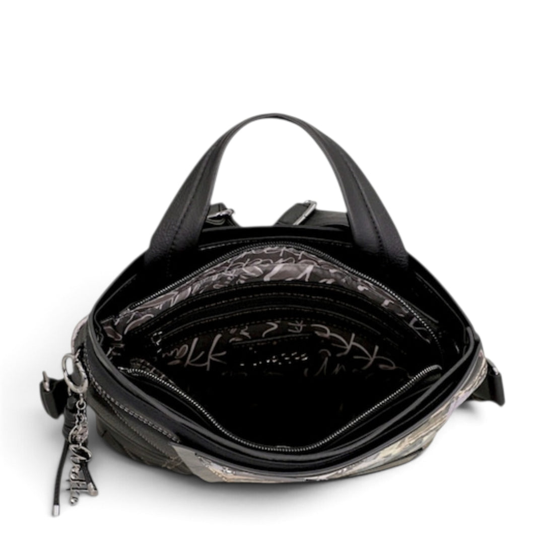 Open black Anekke backpack showing the lined interior, zip compartments, and decorative heart charm from ada-shoes.ro