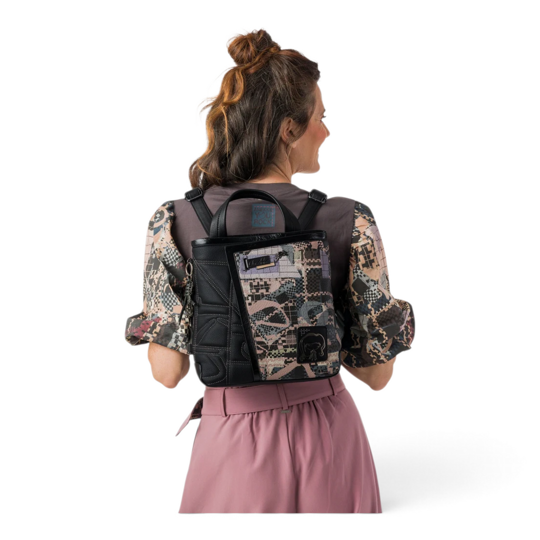 ada-shoes.ro Anekke black casual backpack with patterned panels and metallic details worn by a woman
