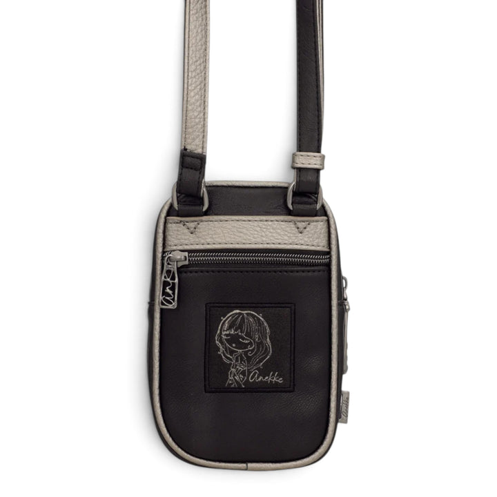 ada-shoes.ro Anekke black crossbody bag with adjustable strap, front zip pocket, and embroidered character detail.