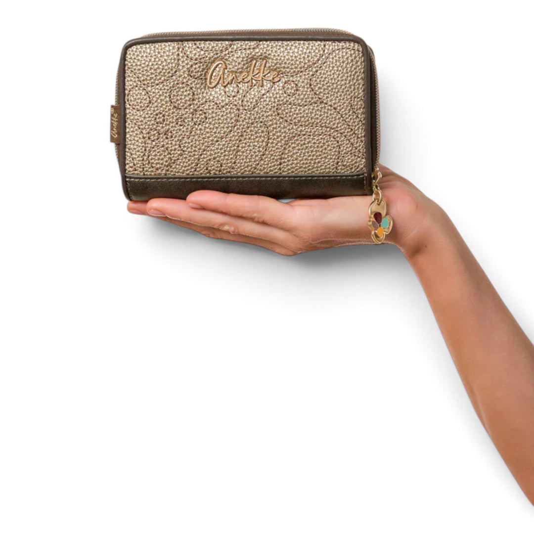 ada-shoes.ro Anekke Blossom RFID wallet in metallic textured faux leather held in a hand