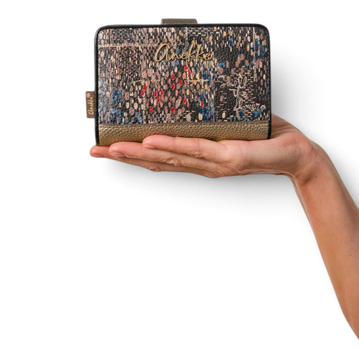 ada-shoes.ro Anekke Blossom medium wallet with textured floral print and gold accents held in a hand