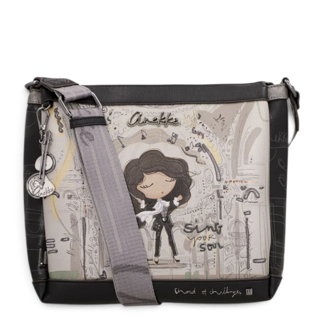 ada-shoes.ro Anekke crossbody bag with artistic musical print, adjustable strap, and decorative metal charms.