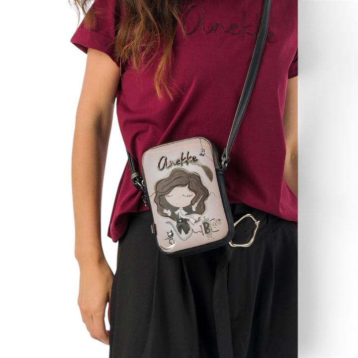 Anekke crossbody bag from ada-shoes.ro featuring a whimsical character illustration, worn as a shoulder bag.