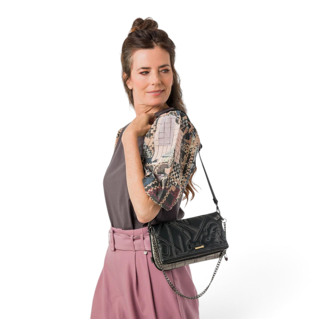 ada-shoes.ro Anekke Iron crossbody bag with decorative chain, worn on the shoulder by a woman in a casual outfit.