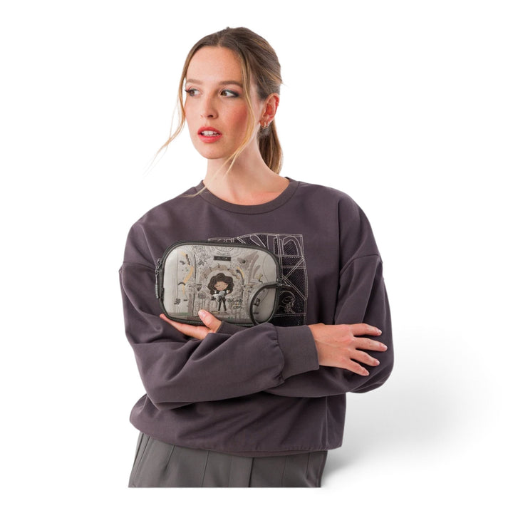 ada-shoes.ro Anekke Orchestra casual crossbody bag with artistic print held by a woman in a grey sweatshirt