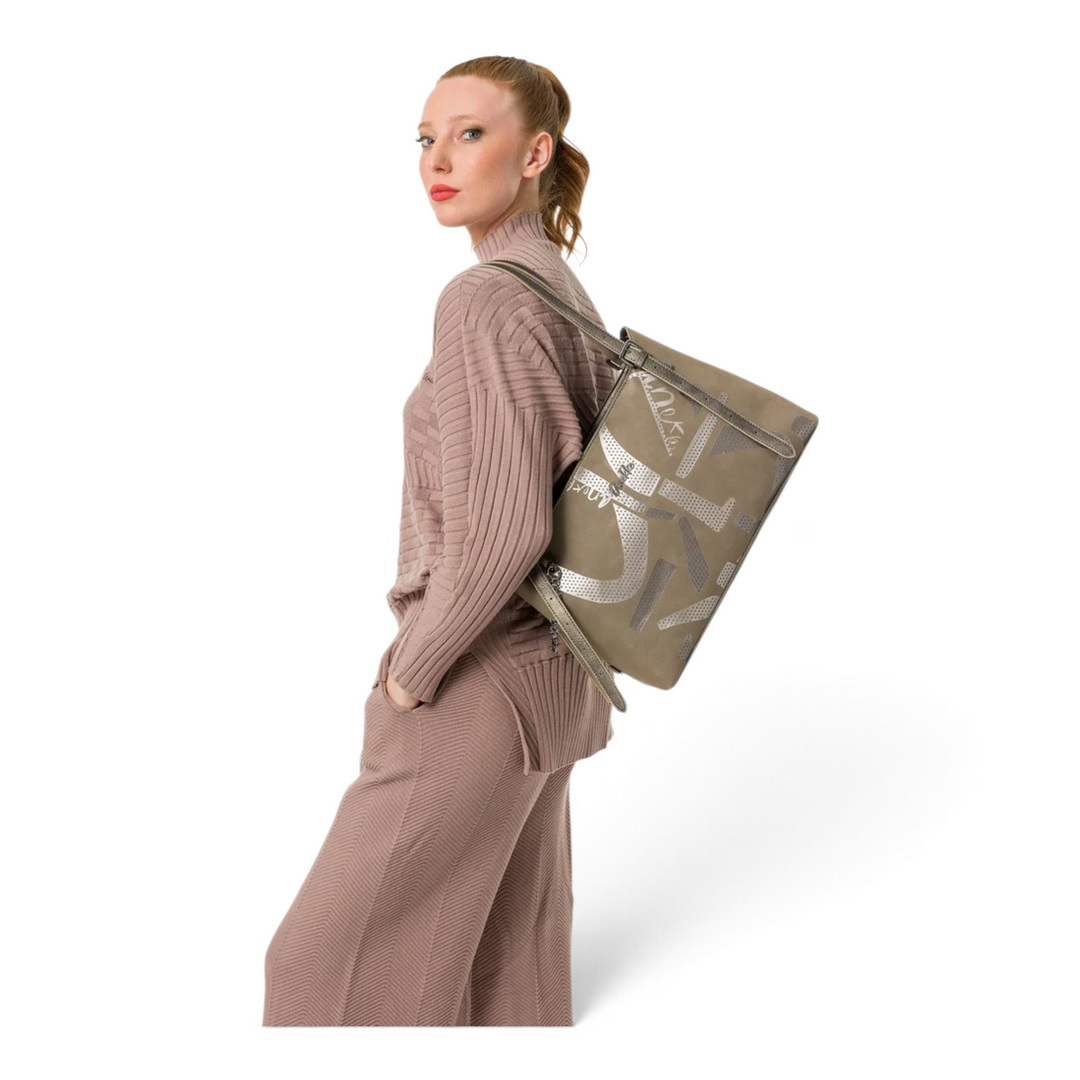 Model wearing an Anekke Essence taupe shoulder bag with decorative graphic print, styled with a matching knitted outfit.