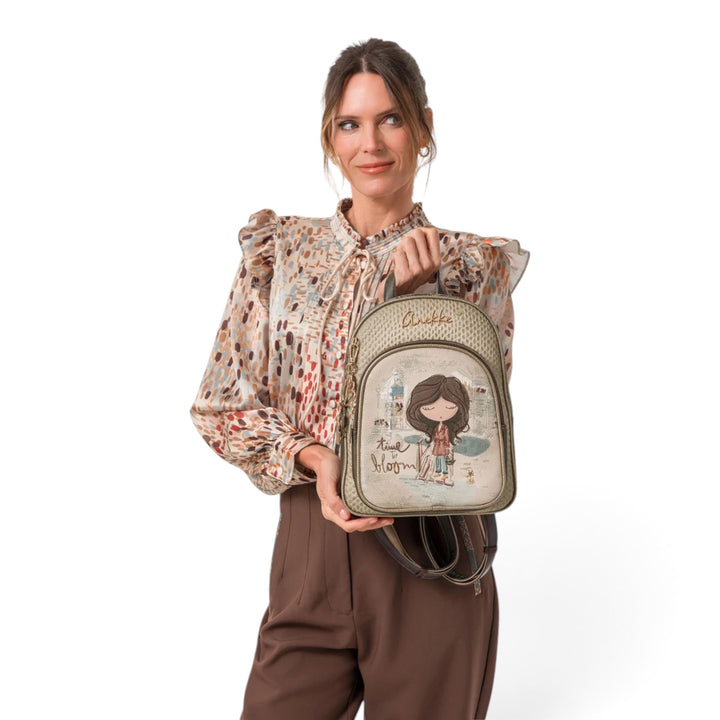 ada-shoes.ro Anekke Tulip casual backpack with illustrated design, held by a woman in a patterned blouse