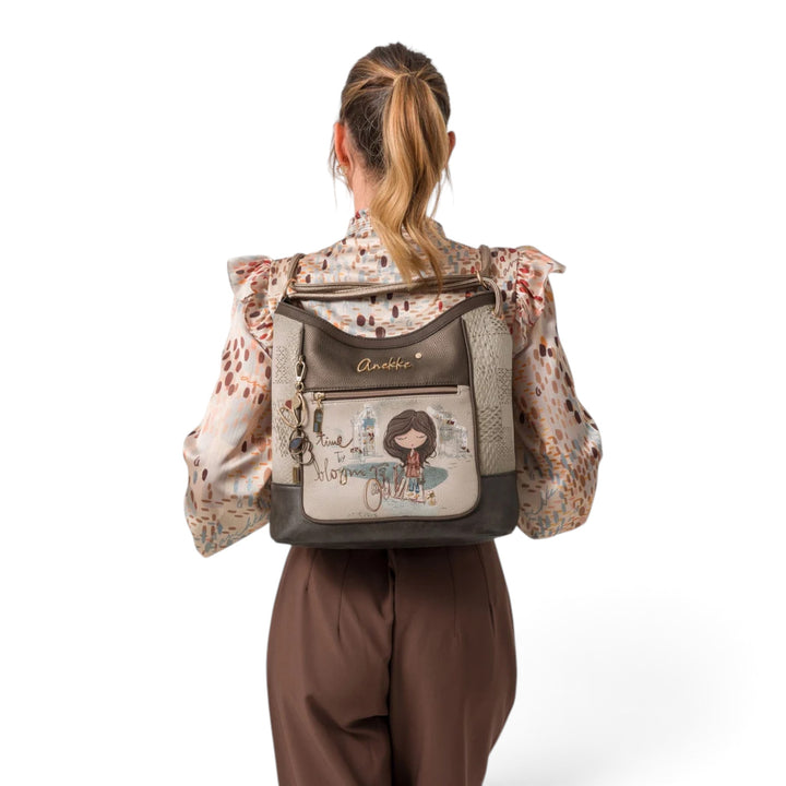 ada-shoes.ro Anekke Tulip convertible shoulder bag and backpack worn by a woman, featuring artistic floral print.