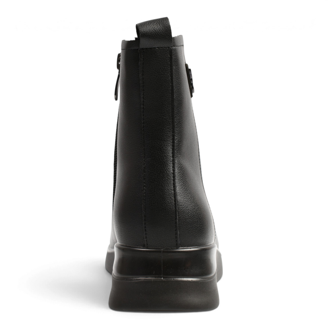 Back view of black Pass Collection ankle boots with a side zipper, pull tab, and ergonomic platform sole.