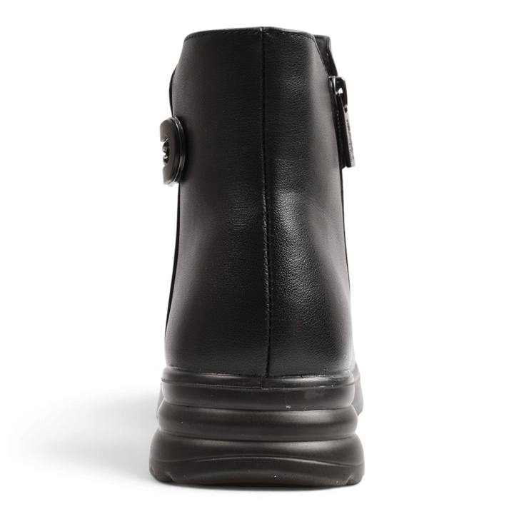 Back view of black leather Pass Collection ankle boots with a thick, ridged sole and side buckle detail.