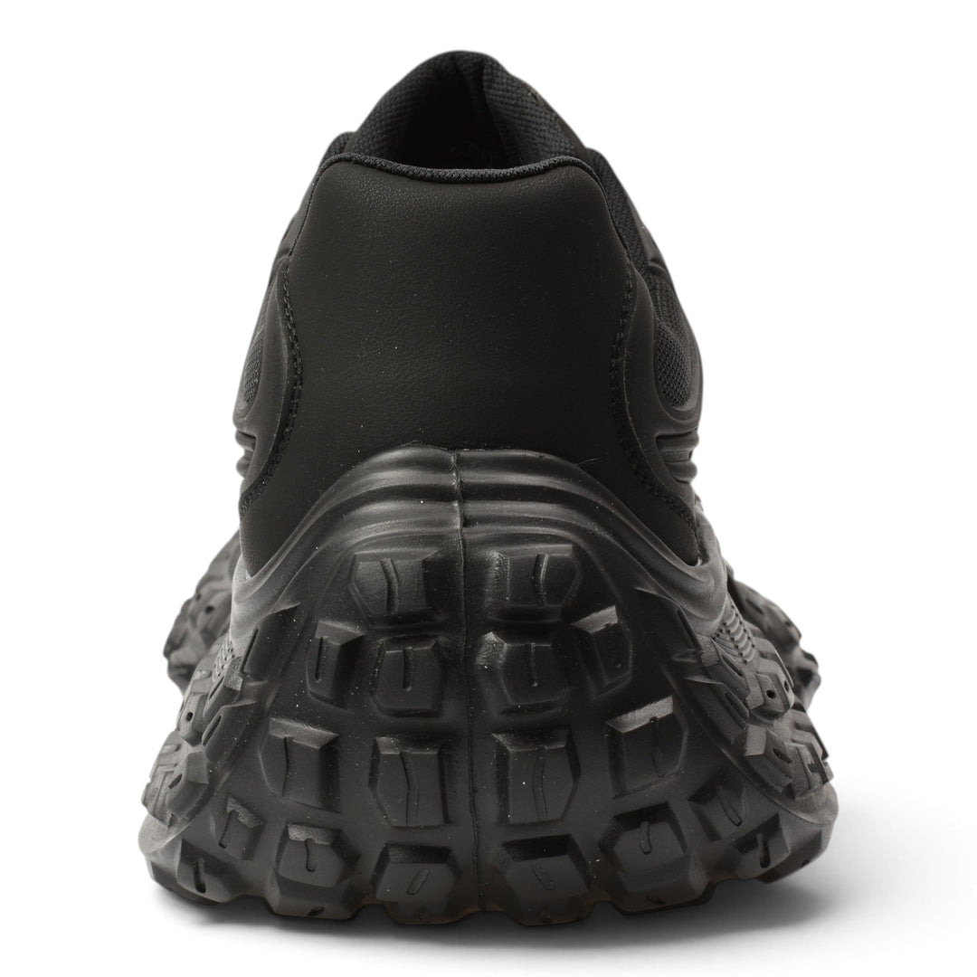 Back view of ada-shoes.ro 6050-N black leather and textile sneakers with a thick, textured, flexible rubber sole.