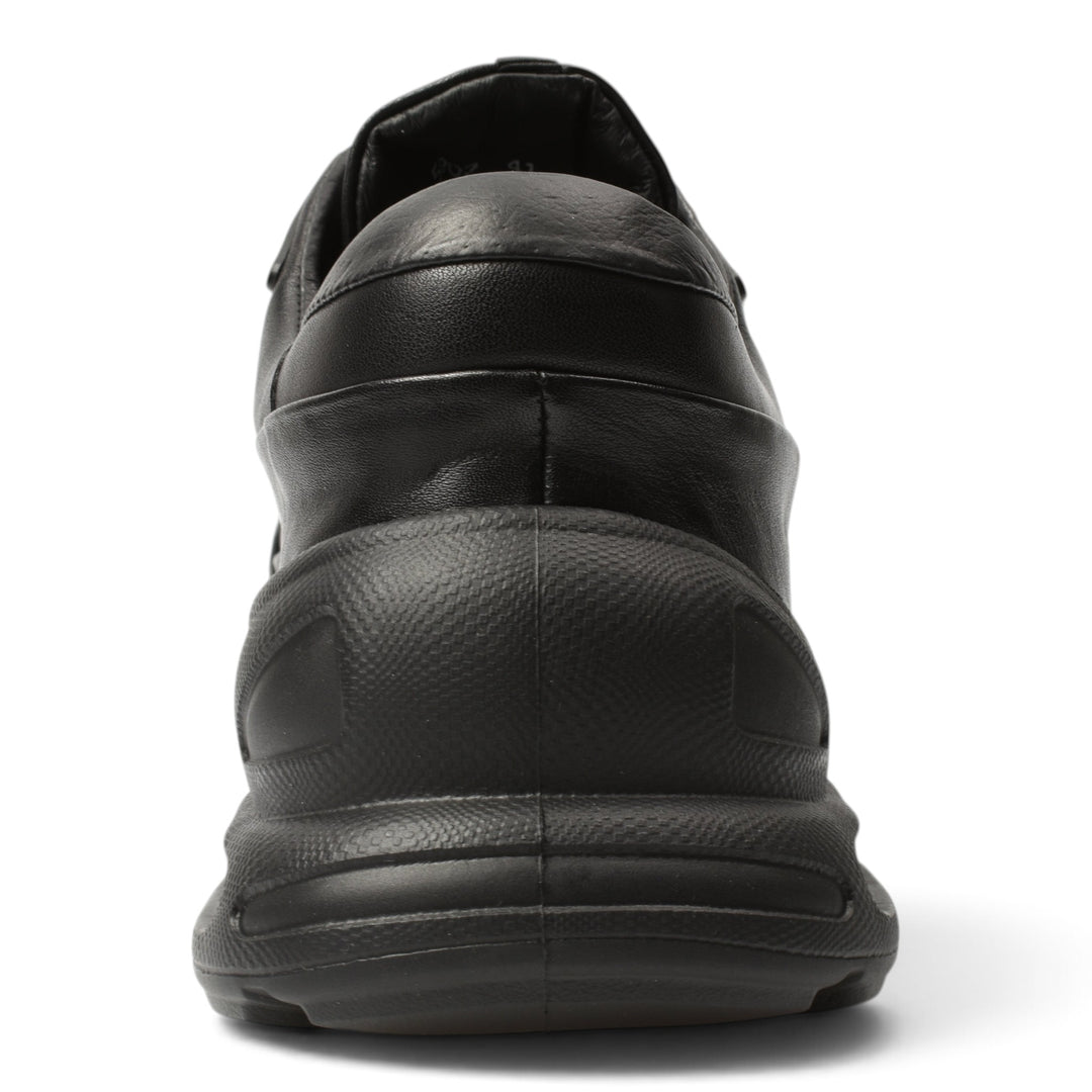 ada-shoes.ro black leather sneakers with a thick, flexible 5cm sole, shown from a rear angle.