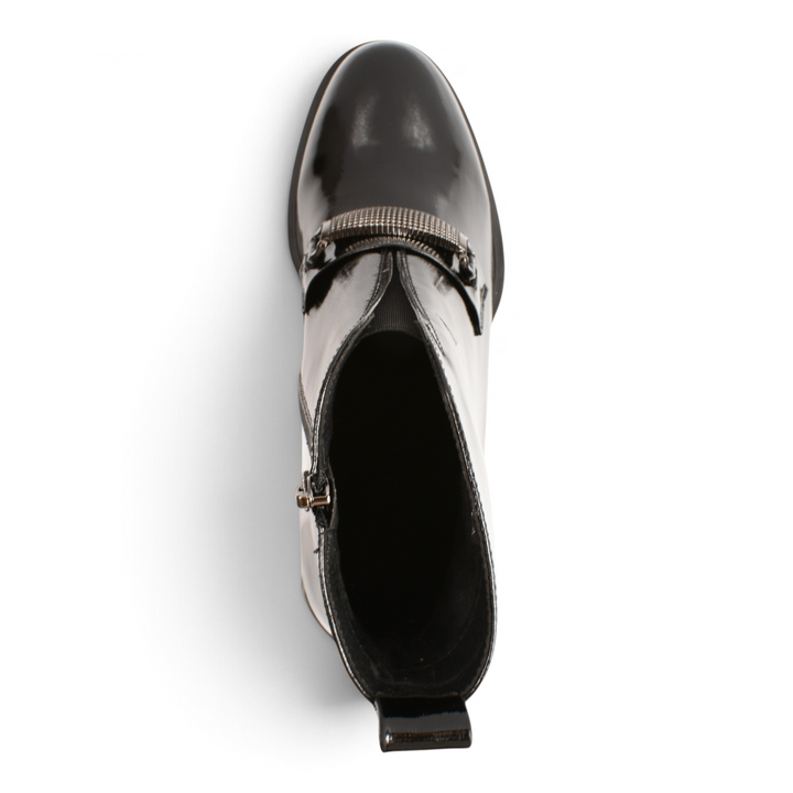 Top view of black patent leather Epica ankle boots with a metallic buckle strap and side zipper.
