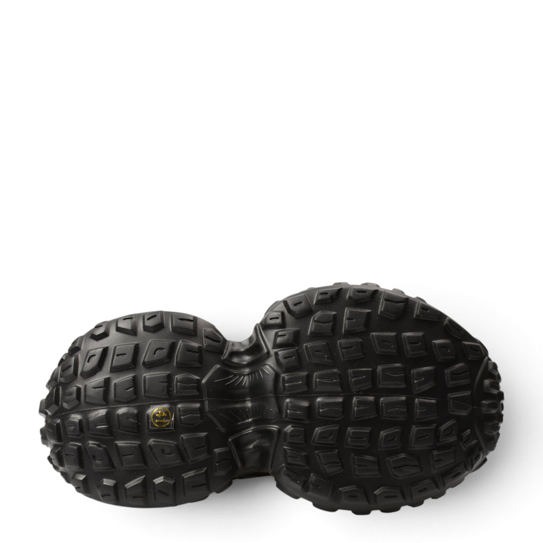 ada-shoes.ro 6050-N black sneaker outsole with a rugged, textured tread pattern for enhanced grip and stability.