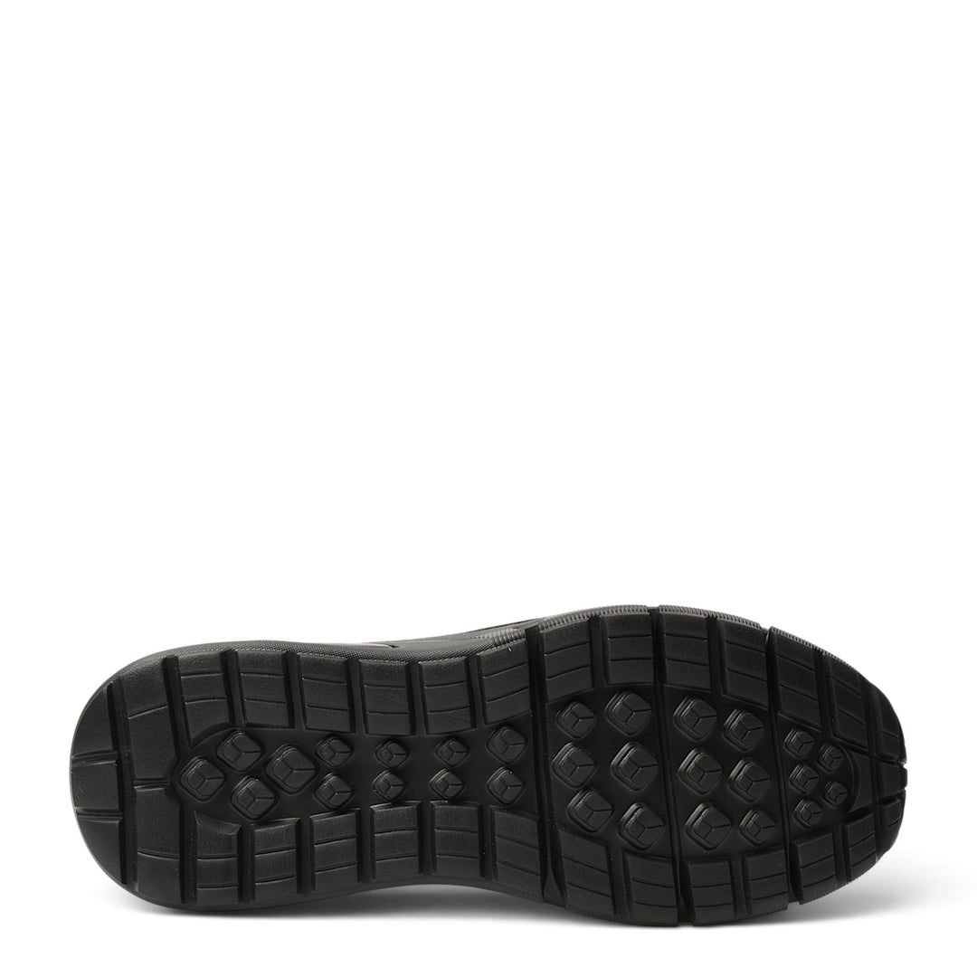 Black rubber outsole of ADA SHOES 3611 sneakers featuring a textured grip pattern for stability and flexibility.