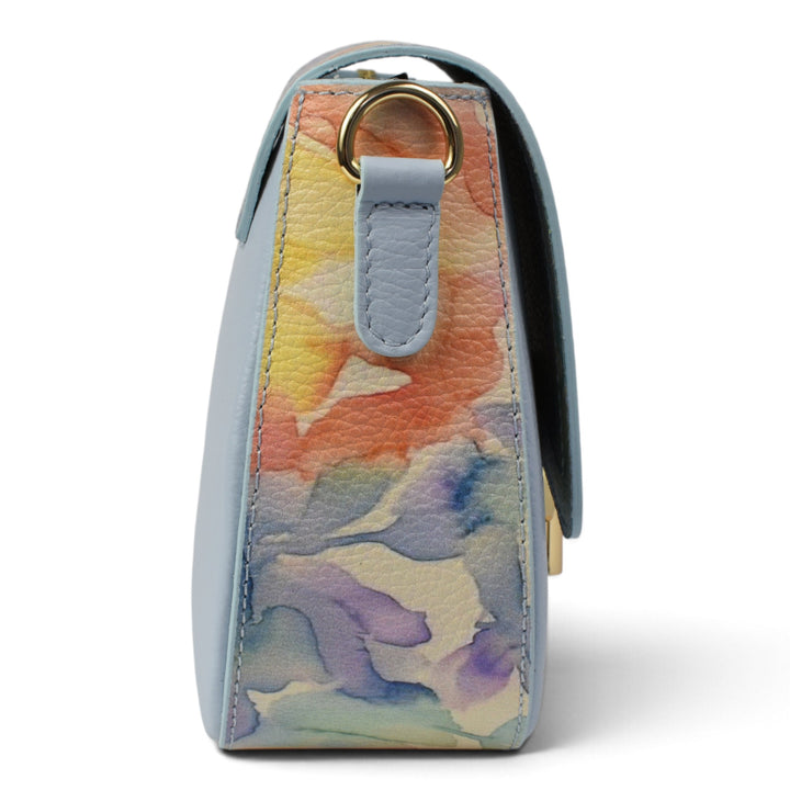 ada-shoes.ro blue leather handbag with a colourful floral side panel and gold hardware, side profile view.