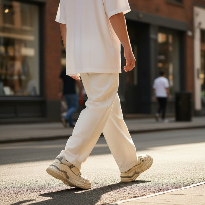 ada-shoes.ro Franco Gerardo sneakers in white leather with a thick sole, worn by a man walking on a city street.