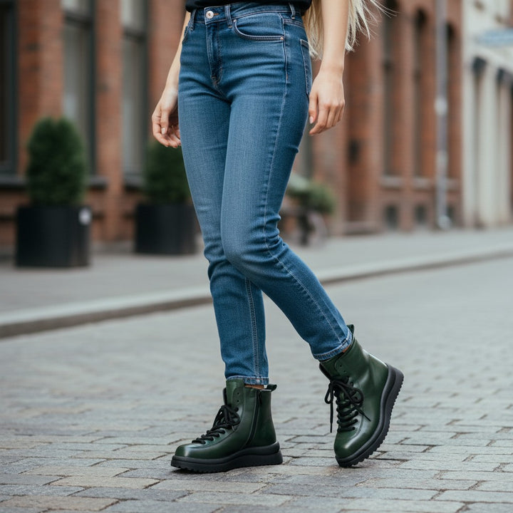 ada-shoes.ro green leather casual boots with laces and side zippers worn with blue jeans on a city street
