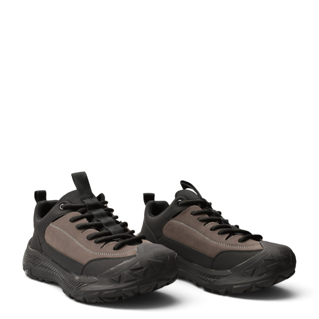 ada-shoes.ro grey and black leather sneakers with suede panels, lace-up closure, and a thick flexible rubber sole.