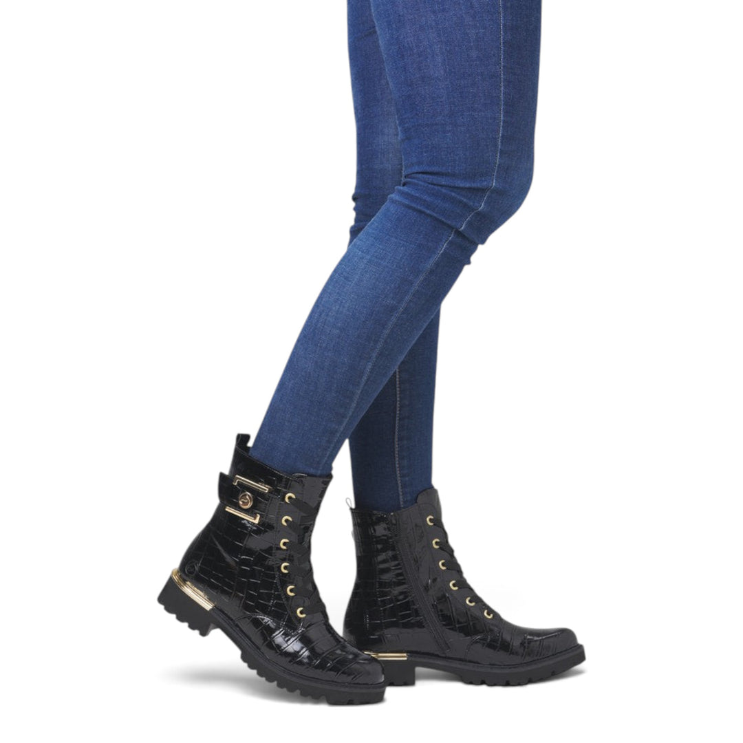 ada-shoes.ro Remonte black crocodile-textured biker boots with gold buckle and lace-up detail worn with blue jeans
