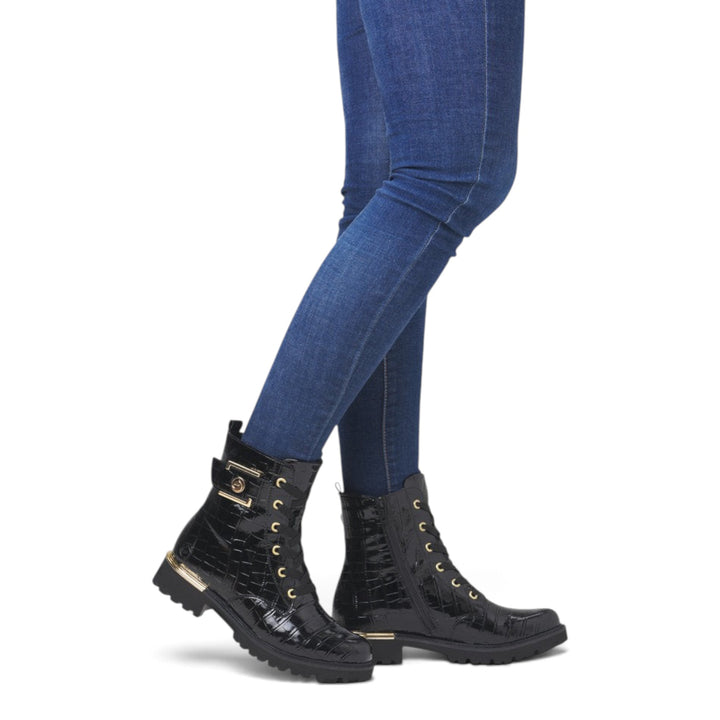 ada-shoes.ro Remonte black crocodile-textured biker boots with gold buckle and lace-up detail worn with blue jeans