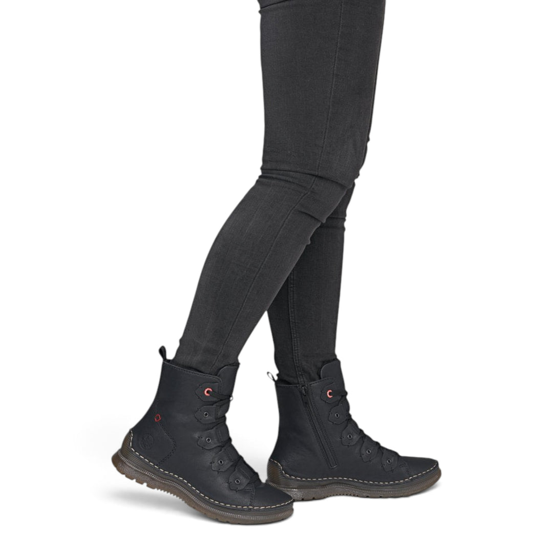ada-shoes.ro Rieker black synthetic leather ankle boots with laces and side zipper, worn with black jeans.