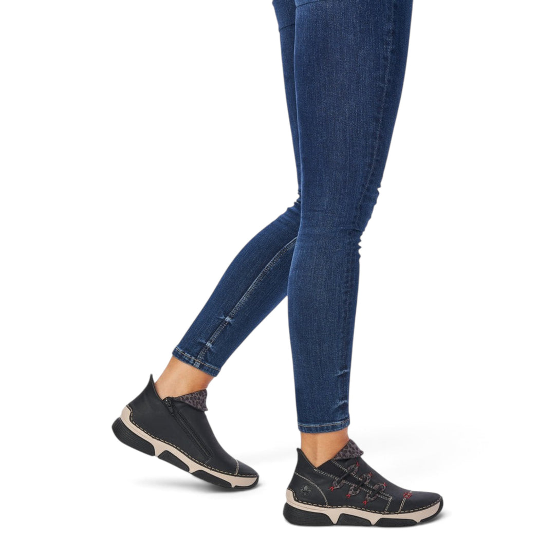ada-shoes.ro Rieker black faux leather ankle boots with side zipper and felt lining worn with blue jeans