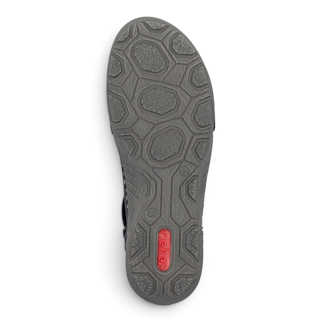 ada-shoes.ro Rieker black ankle boot sole with a textured hexagonal pattern for grip and a red logo insert