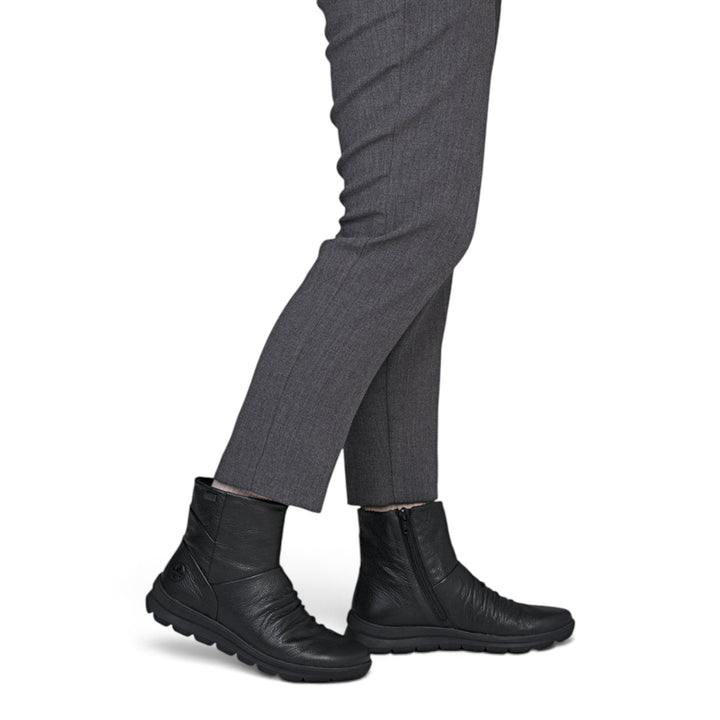 ada-shoes.ro Rieker black leather ankle boots with RiekerTEX membrane and side zipper worn with grey trousers