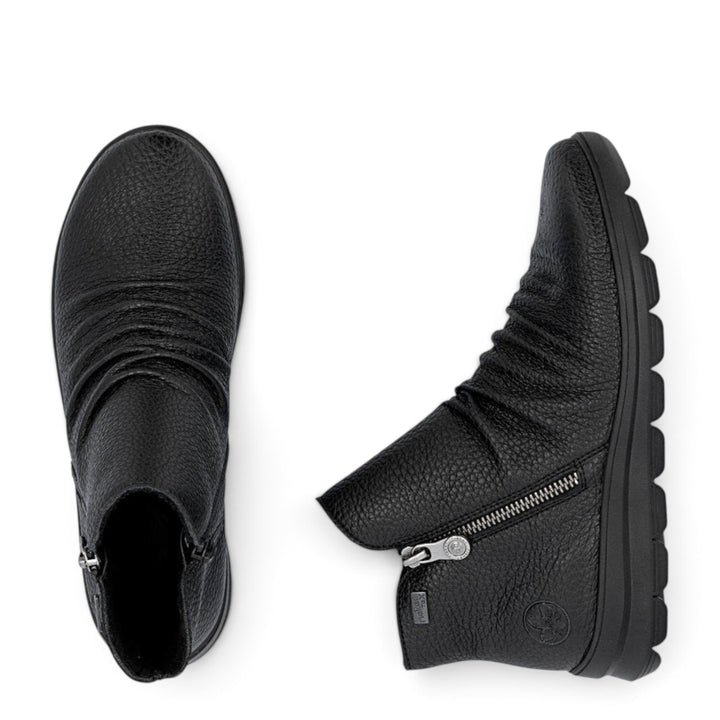 ada-shoes.ro Rieker black leather ankle boots with side zipper, warm lining, and flexible Antistress sole.