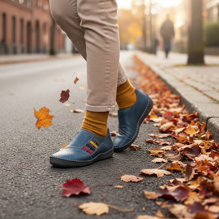 ada-shoes.ro Rieker blue leather casual shoes with colorful accents worn with mustard socks on an autumn street