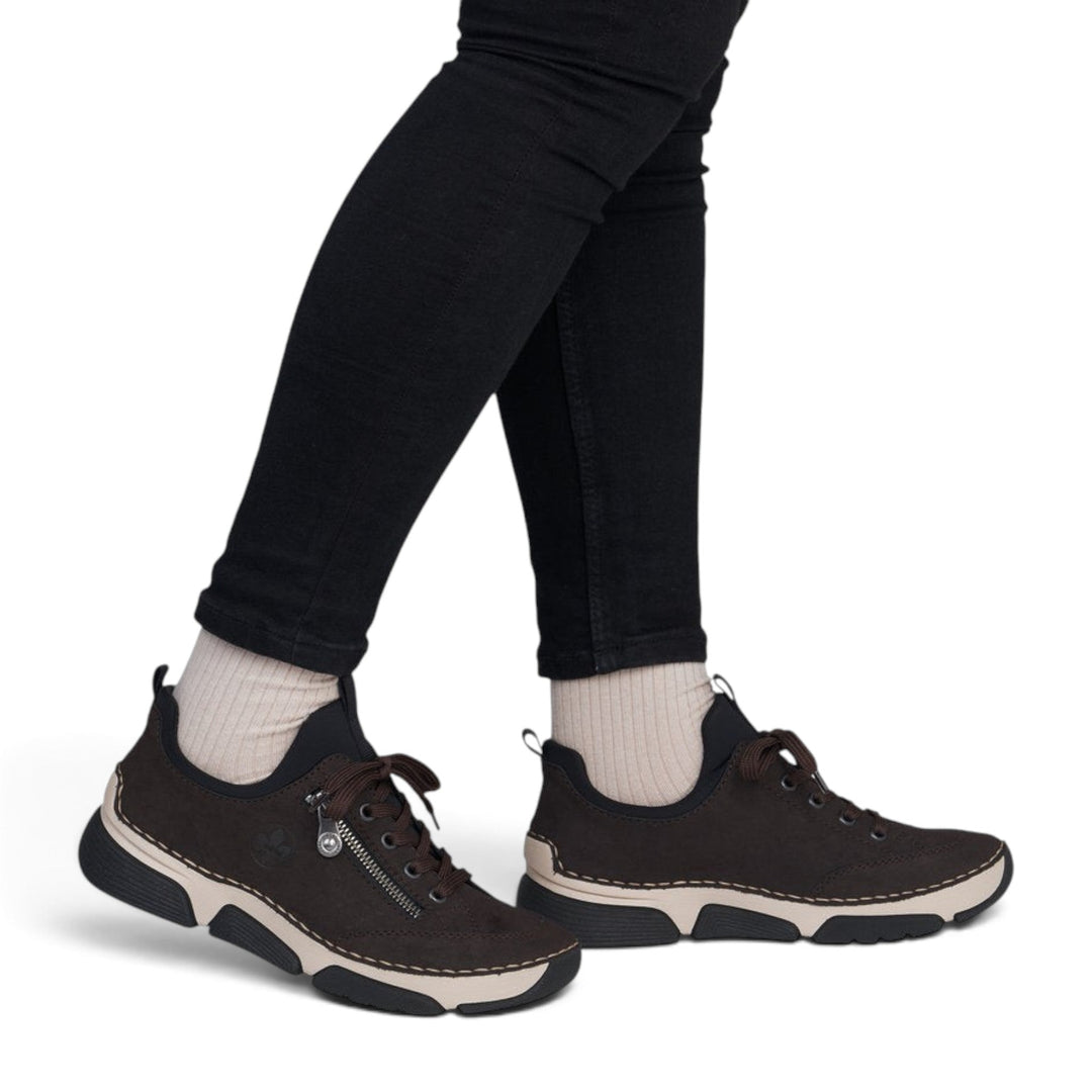 ada-shoes.ro Rieker brown casual sneakers with lace-up closure and Antistress sole worn with black jeans
