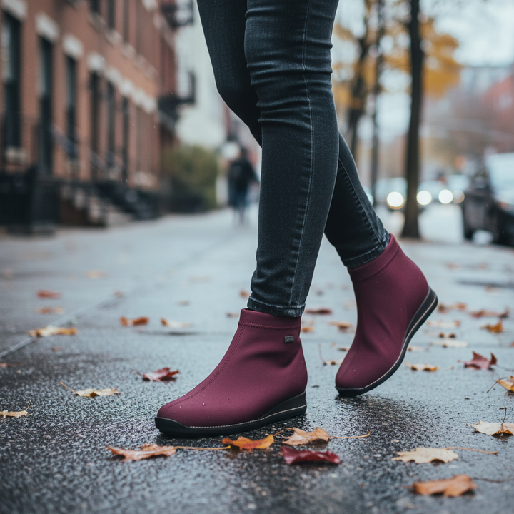 ada-shoes.ro Rieker burgundy stretch fabric ankle boots with warm lining and flexible sole worn on a city street