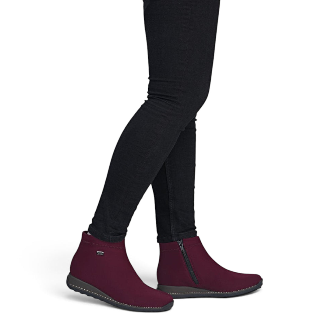 ada-shoes.ro Rieker burgundy stretch fabric ankle boots with warm lining, side zipper, and flexible sole on a model
