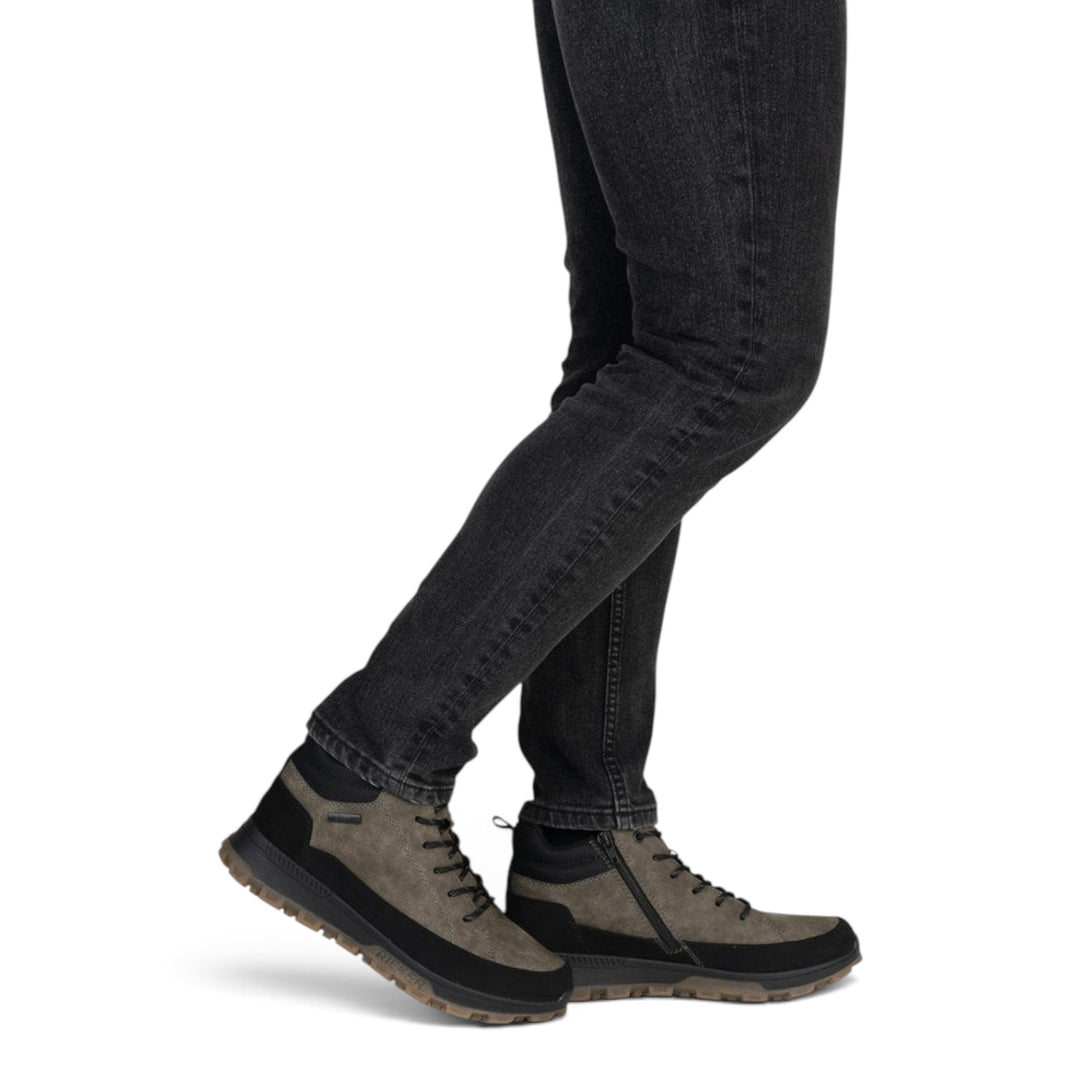 ada-shoes.ro RIEKER grey faux leather outdoor boots with side zipper and laces worn by a man in black jeans