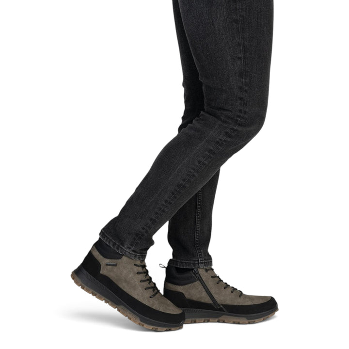 ada-shoes.ro RIEKER grey faux leather outdoor boots with side zipper and laces worn by a man in black jeans