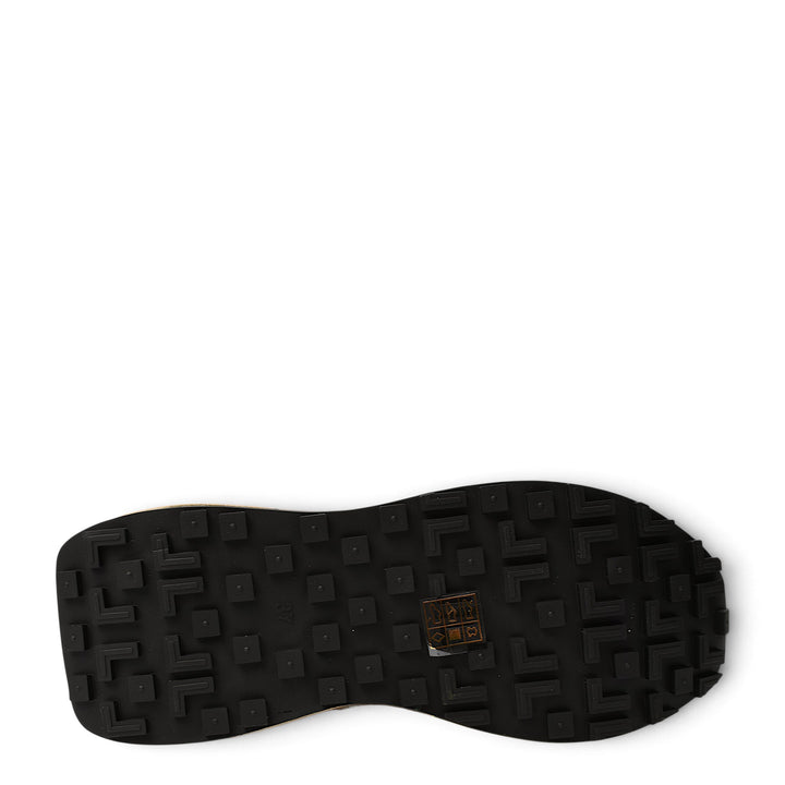Black rubber outsole of ada-shoes.ro red leather sneakers with a textured geometric tread pattern for grip.