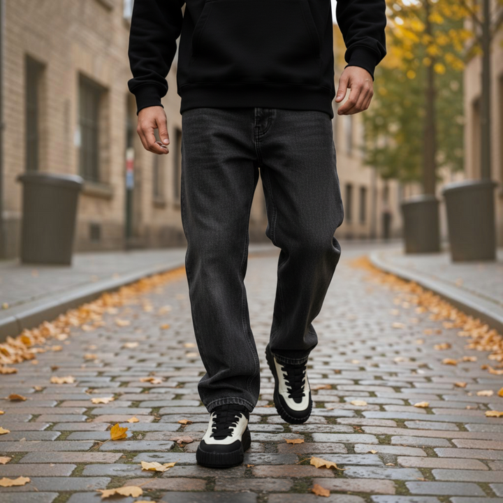 ada-shoes.ro Gryxx JS90003B black and white leather sneakers worn by a man walking on a cobblestone street