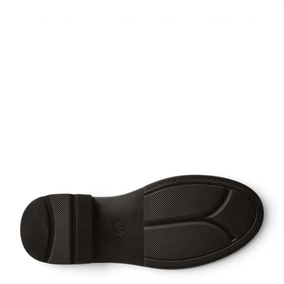 Black rubber sole of an Anna Viotti casual loafer with a textured grip pattern and low block heel.