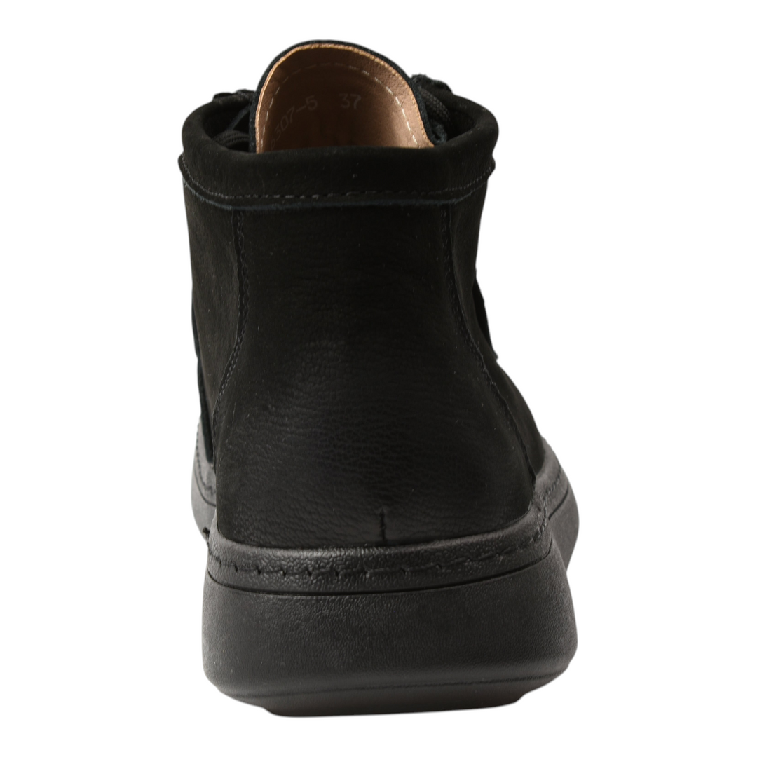 ada-shoes.ro black suede moccasin-style ankle boots with a flexible flat sole, viewed from the back.