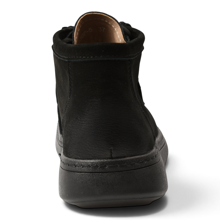 ada-shoes.ro black suede moccasin-style ankle boots with a flexible flat sole, viewed from the back.