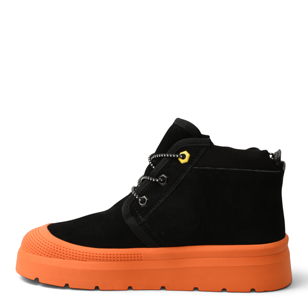 ada-shoes.ro black suede ankle boots with a thick orange sole, textured toe cap, and trekking-style laces.
