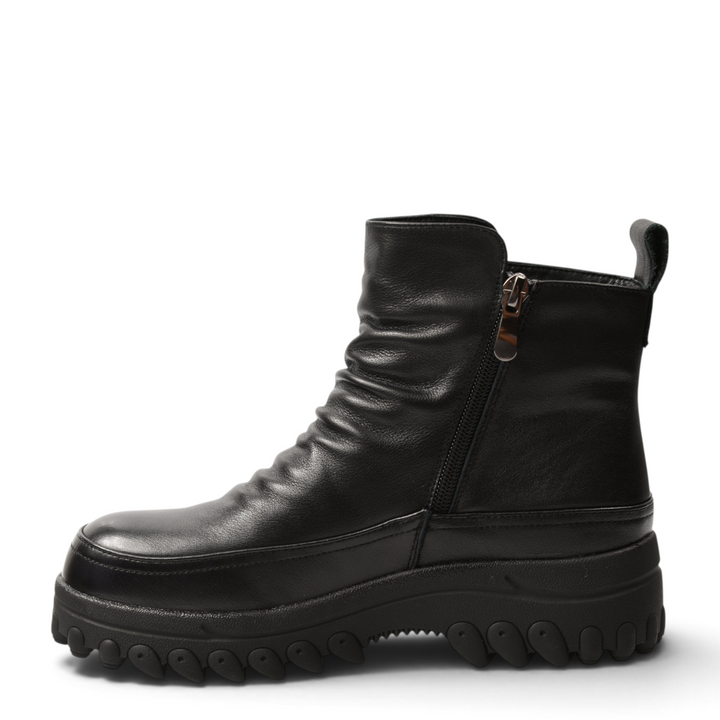 ada-shoes.ro black leather ankle boots with side zip, pleated front, and chunky lug sole for a casual-chic look.