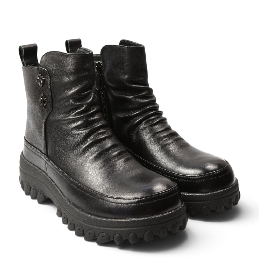 ada-shoes.ro black leather ankle boots with front pleats, thick lug sole, and side zipper for casual-chic style.